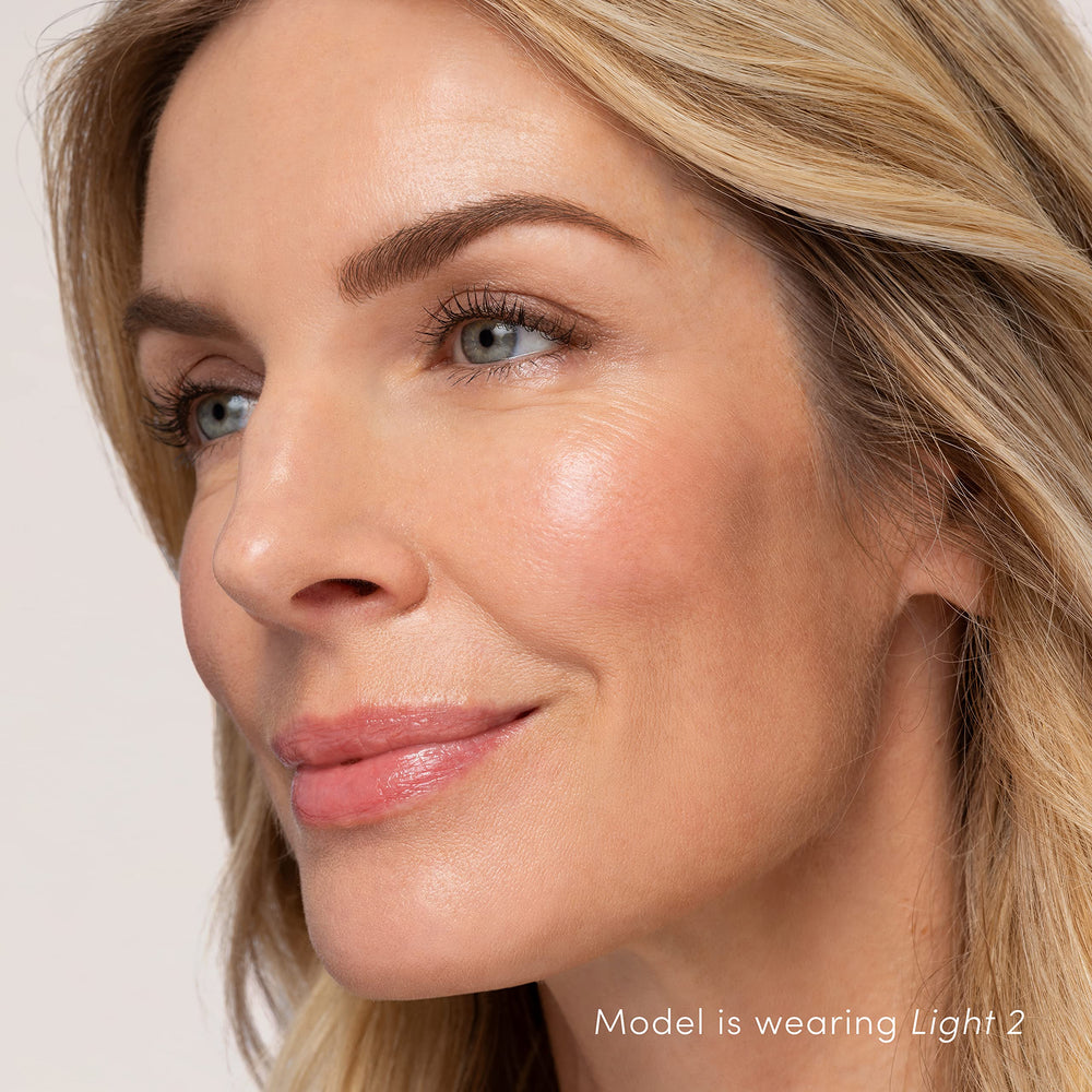 Porcelain skin tone appears even with HydroPure Tinted Serum.