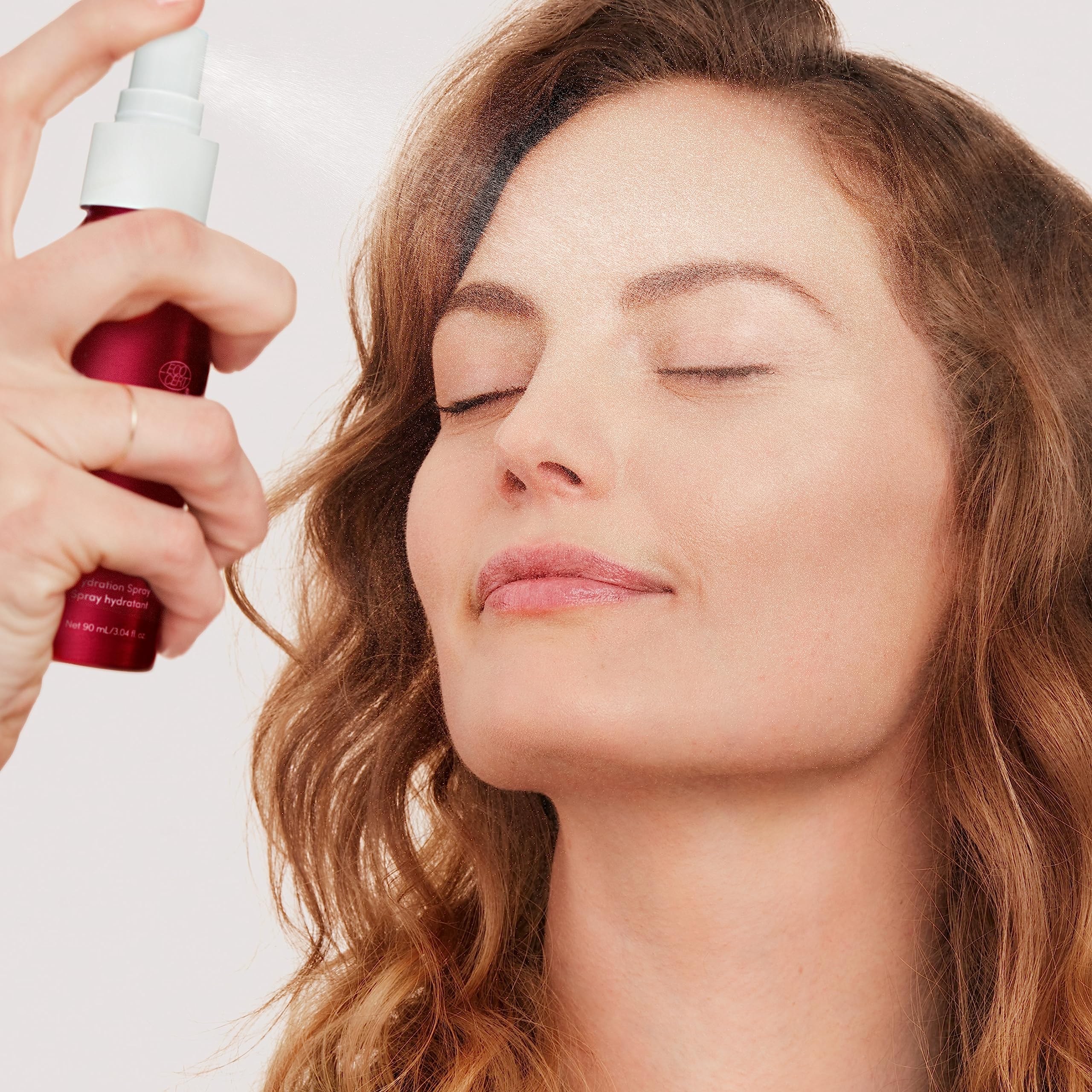 Jane Iredale Pommisst setting spray helps set makeup for longer wear.