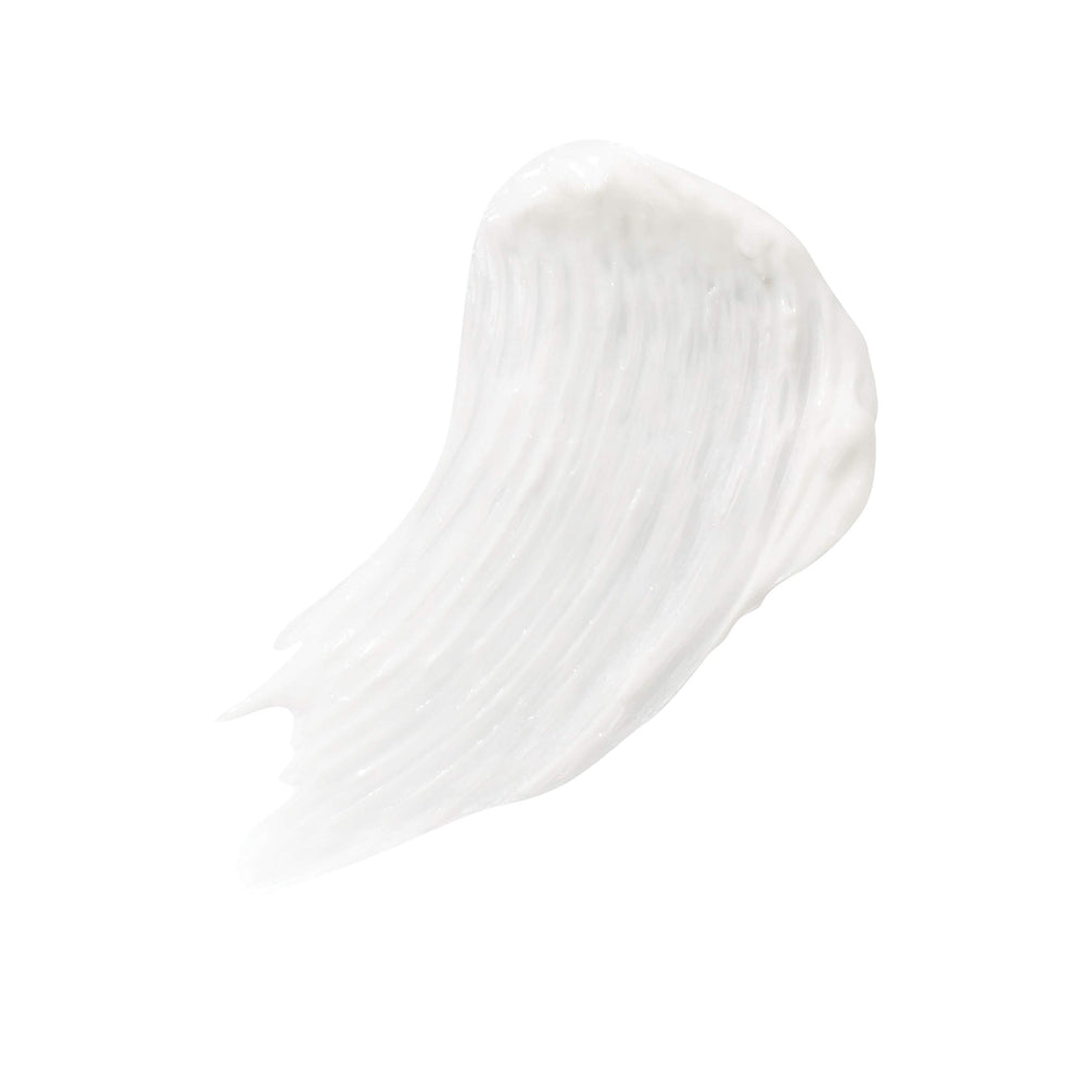 Close-up of the PureLash brush applying conditioner to lashes before mascara.