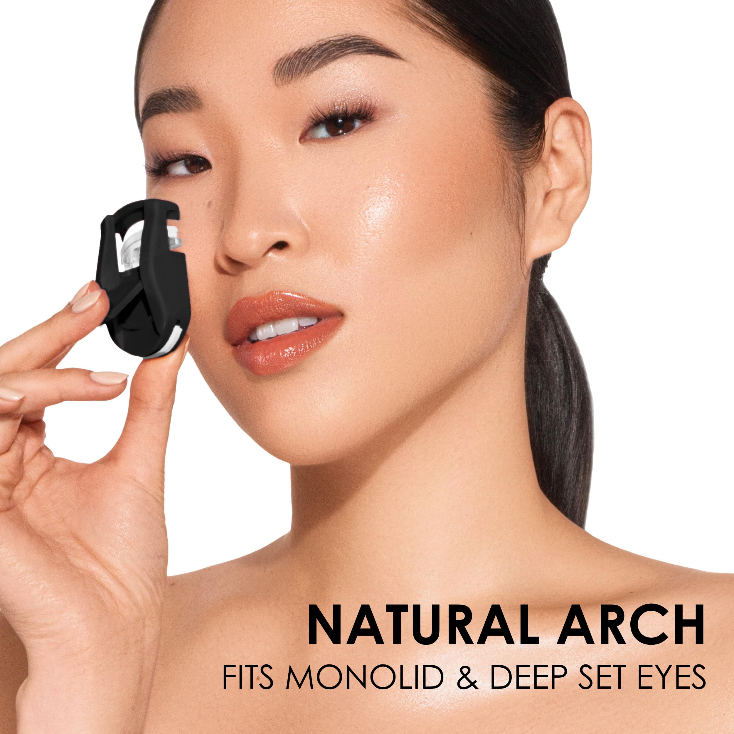 Compact JAPONESQUE curler in hand shows natural arch squeeze.
