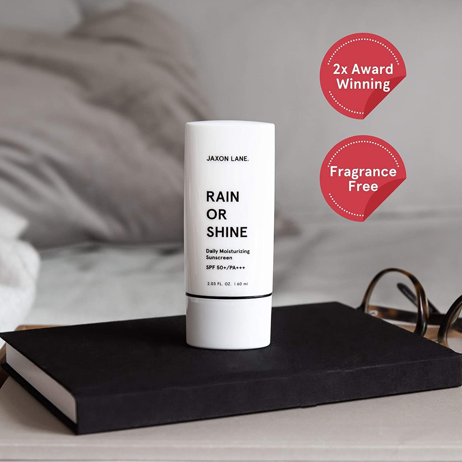 JAXON LANE Rain or Shine SPF50 application on face highlights quick absorption.