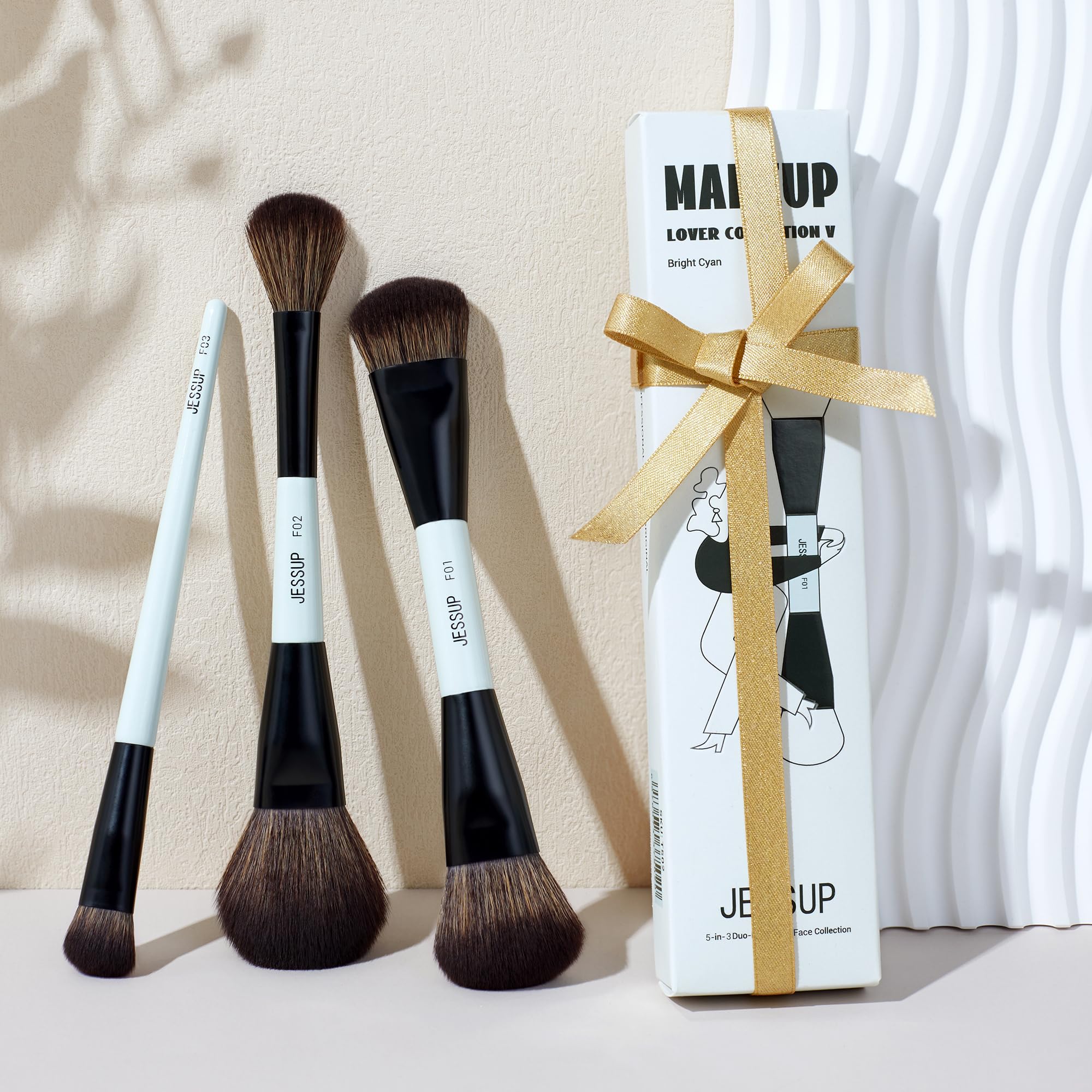 Jessup blue 3pc brush set displayed on a vanity for easy access.