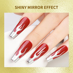 JODSONE chrome mirror finish on nails reflecting light for a futuristic look.