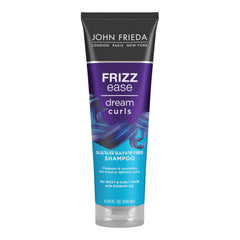 Botella de John Frieda Dream Curls para definir rizos y controlar el frizz.