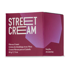 JOHNNY B. Street Cream envase de 3 oz para peinados duraderos.