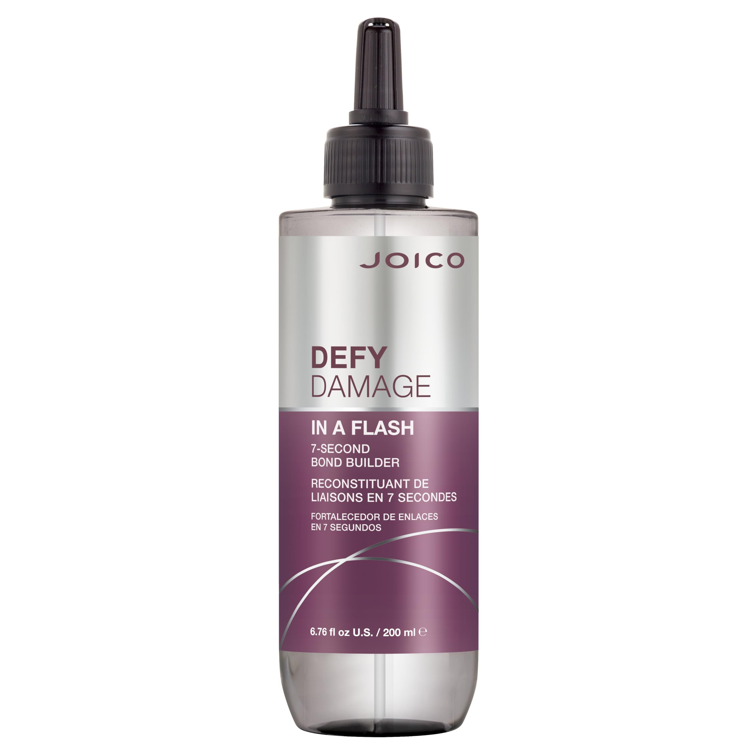 Joico Defy Damage In A Flash bottle being poured for quick bond support.