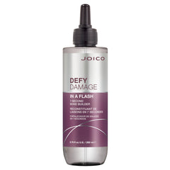 Joico Defy Damage In A Flash bottle being poured for quick bond support.