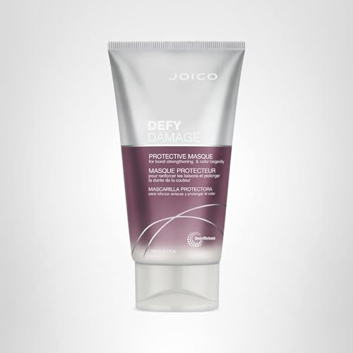 Joico Defy Damage Masque being applied to damp hair for bond improvement.