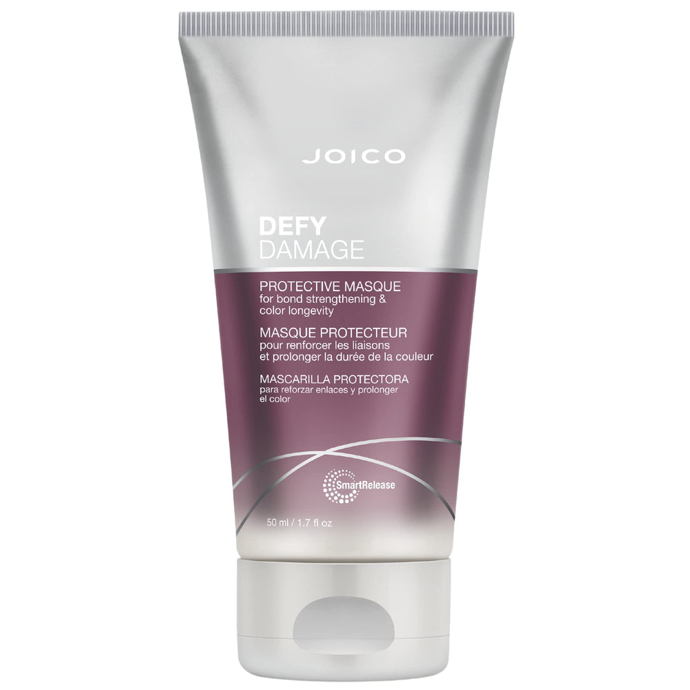 Joico Defy Damage Masque en envase transparente ofrece reparación de enlaces y protección de color.