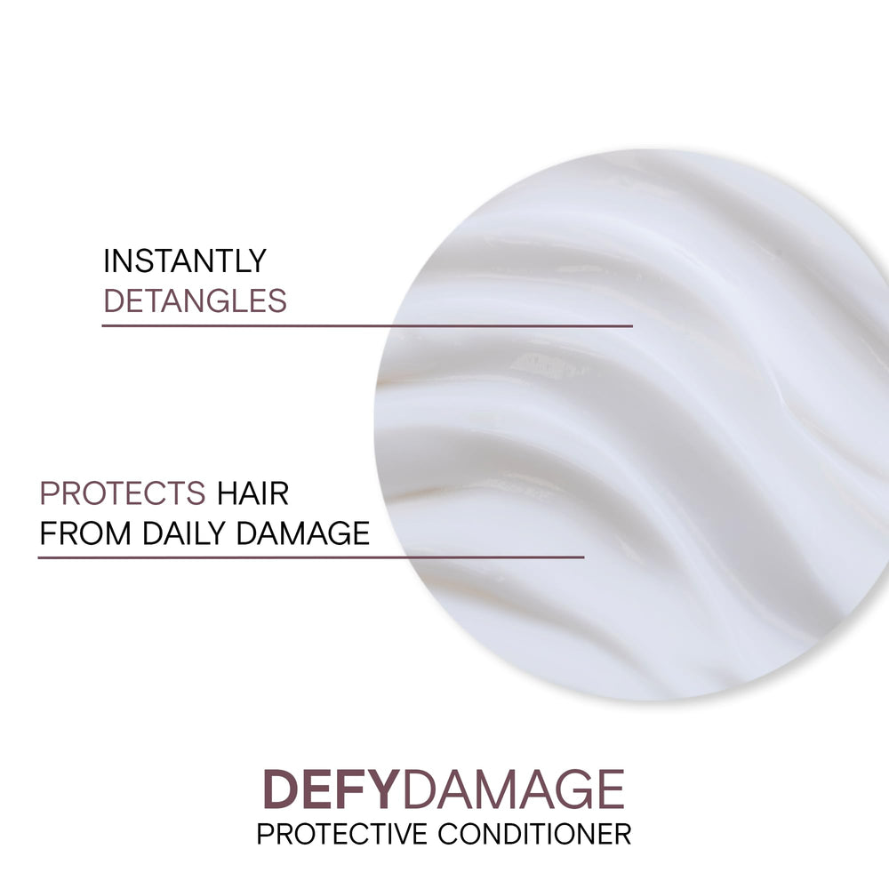 Creamy texture close-up of Joico Defy Damage Protective Conditioner showing rich moisture