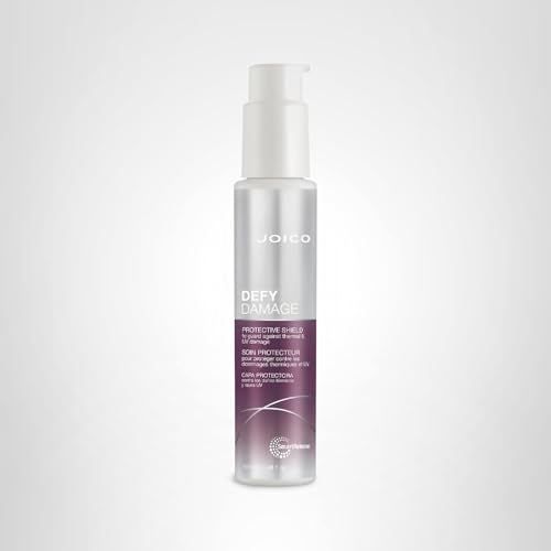 Joico Defy Damage Shield creamy texture on hand for quick application.