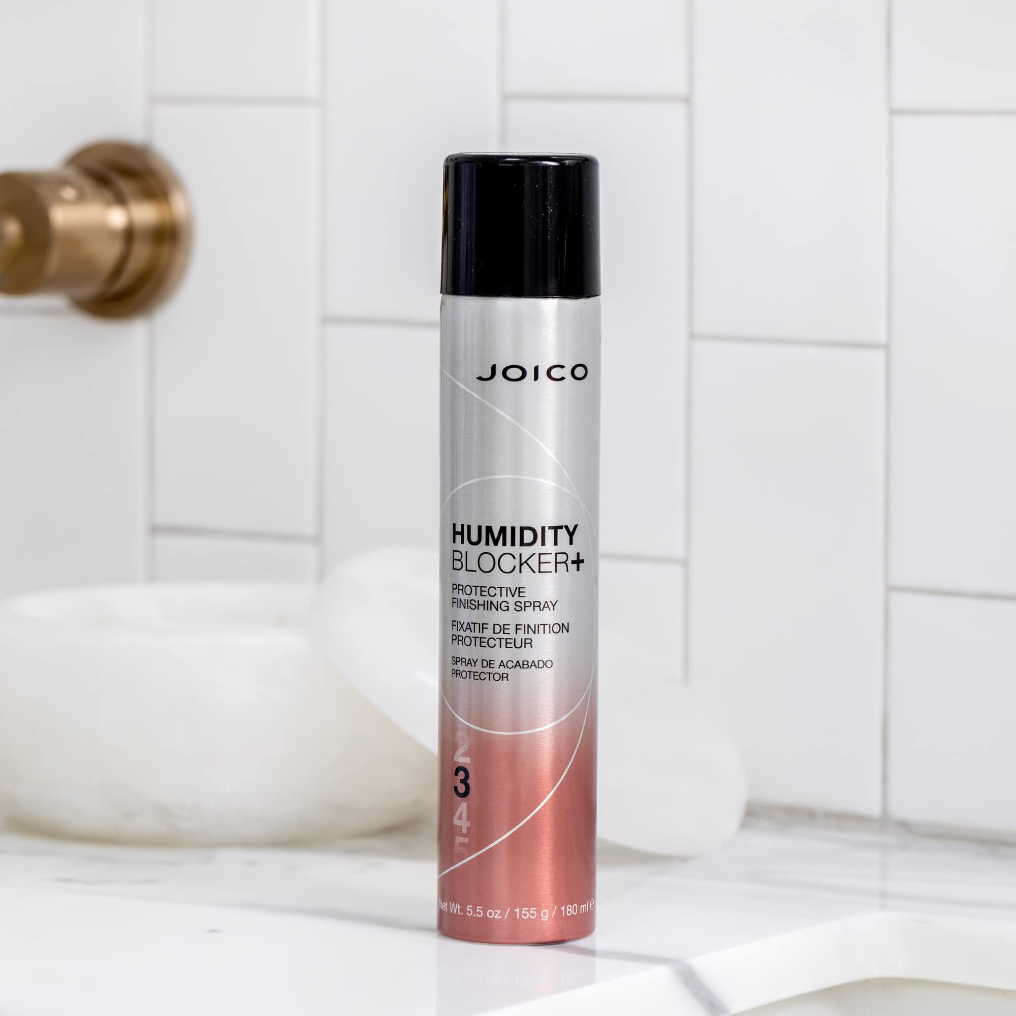 Joico Humidity Blocker demonstrates anti-frizz control on styled hair.