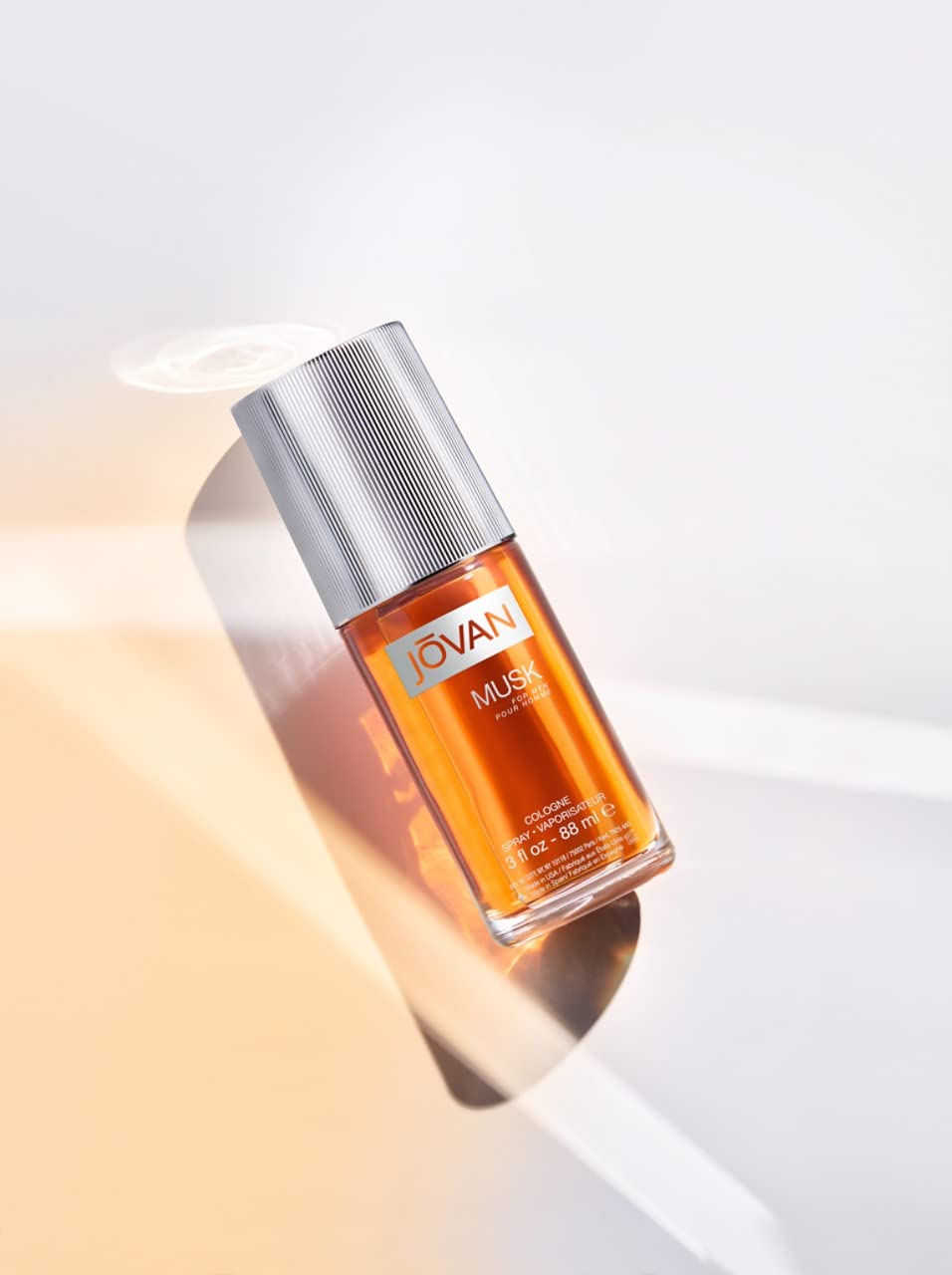 Jovan Musk for Men amber glow shot conveys warm, enduring fragrance