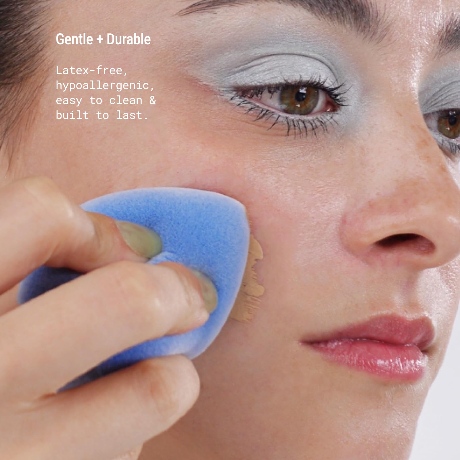 JUNO & Co velvet blue sponge beside makeup kit for daily routine.