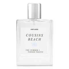 Just Juice Cousins Beach bottle pour shows a bright citrus opening for sunny days