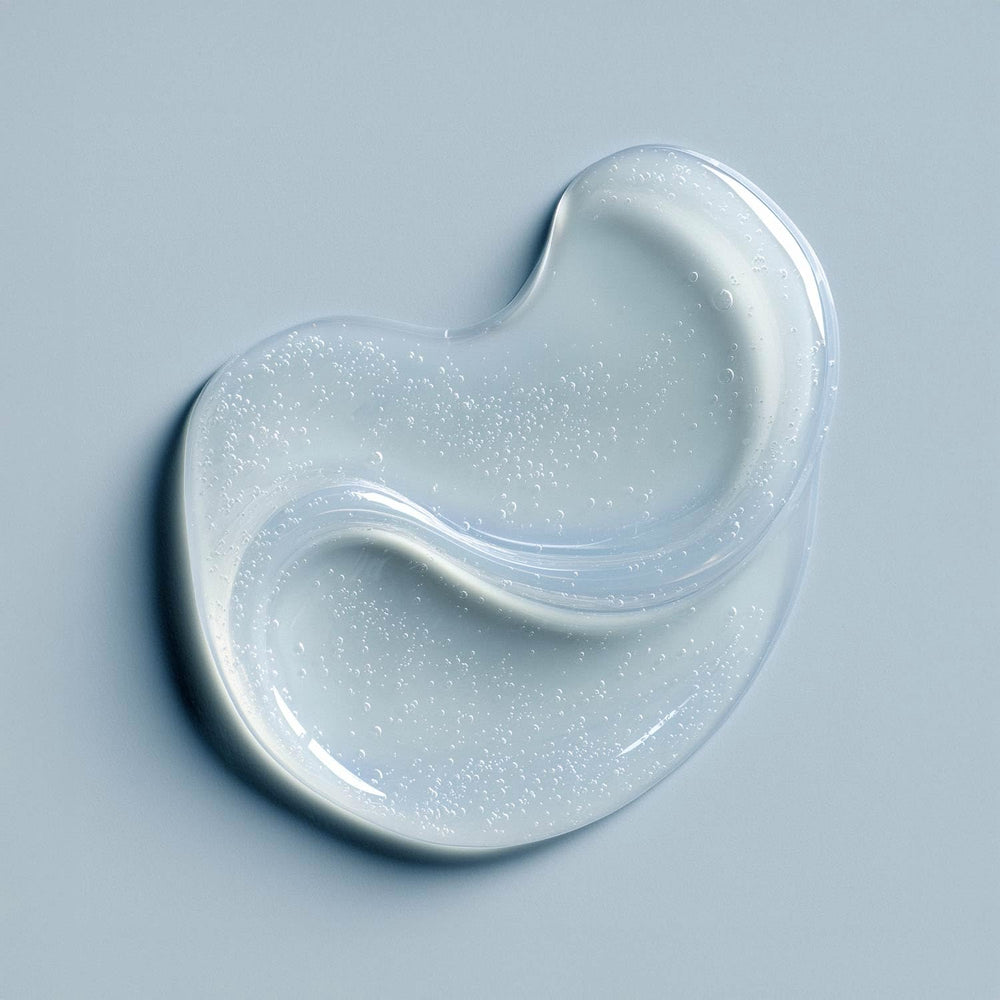 Just Nutritive Gray Hair Shampoo being poured to reduce yellowing buildup.