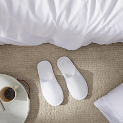 Juvale disposable slippers individually wrapped to stay clean for guests.