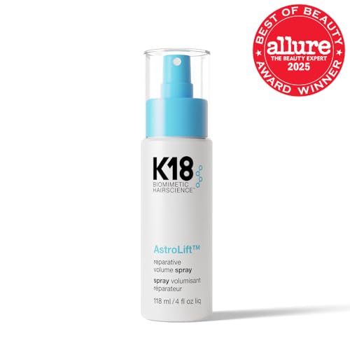 K18 AstroLift mist being sprayed to evenly lift roots and body.