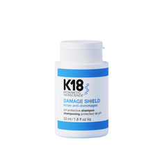 K18 Damage Shield Champú, botella frontal, protege el color y aporta brillo suave.