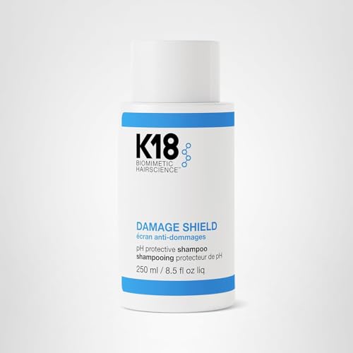K18 Damage Shield bottle on shelf emphasizing microbiome-friendly care.