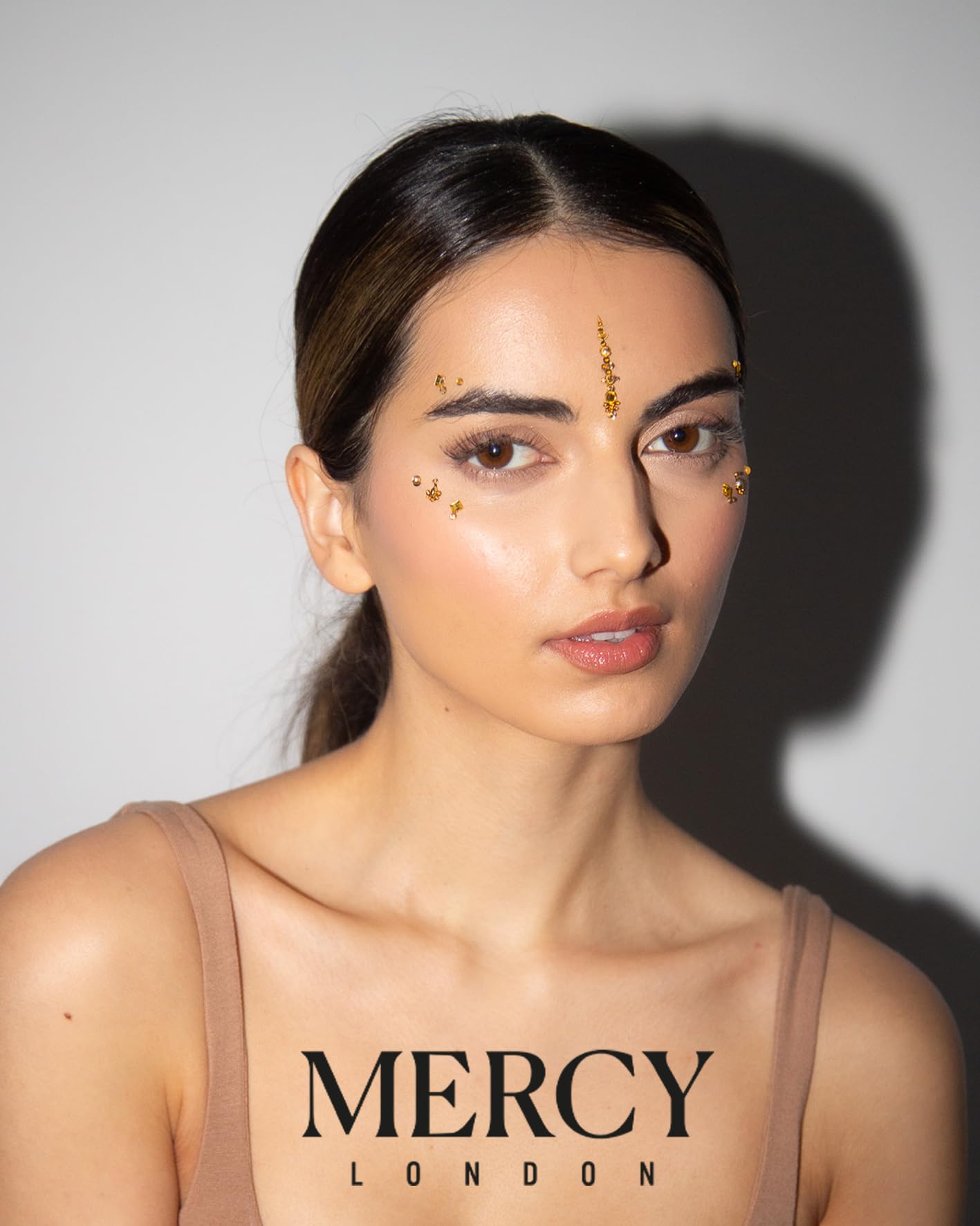 Nail art pairing with Karizma bindi for coordinated style.