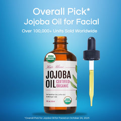 Close-up of Kate Blanc Organic Jojoba Oil in glass bottle for skin hydration.