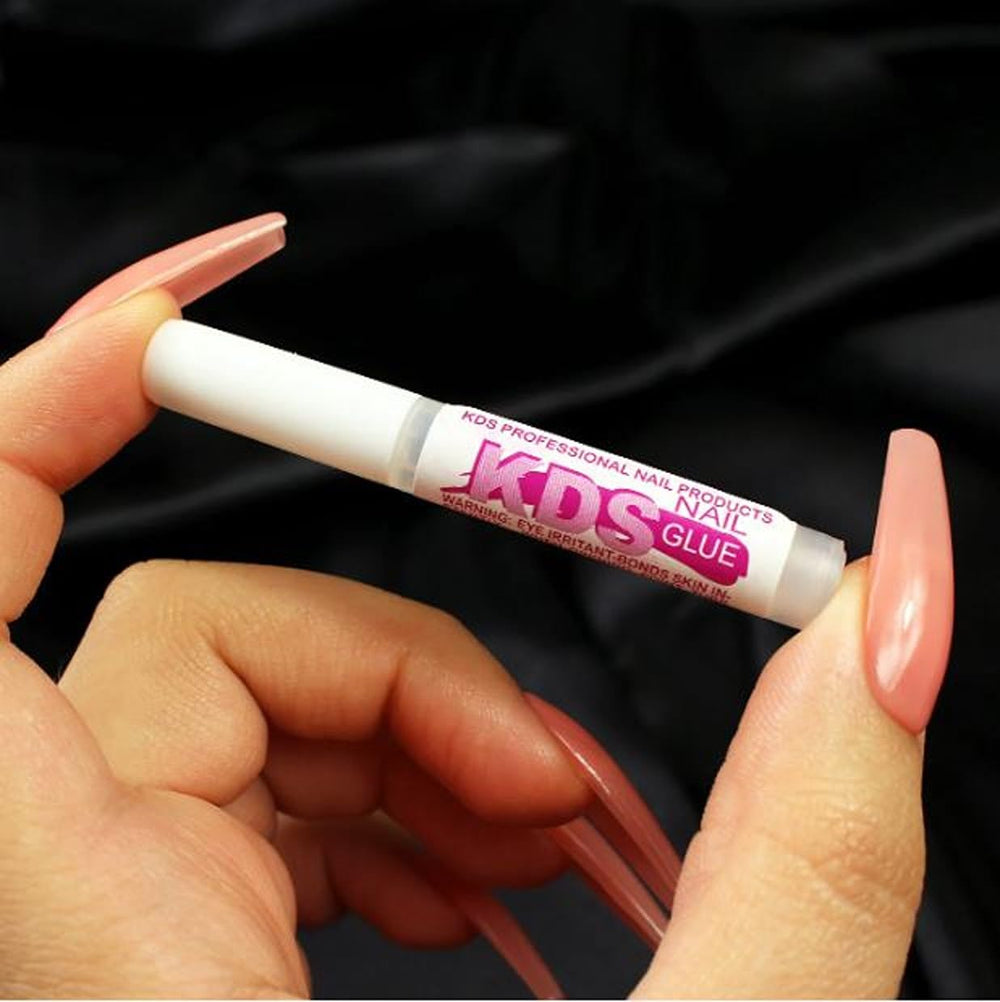 KDS Nail Glue plastic-compatible formula ensures strong adhesion with acrylic tips.