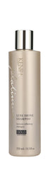 Kenra Platinum Lujo Brillo Shampoo, botella dorada, brillo profesional y suavidad diaria.