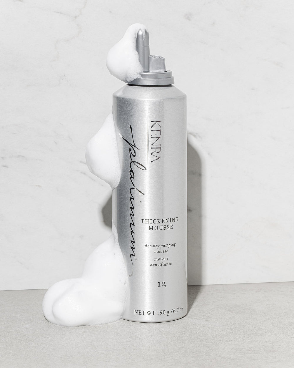 Kenra Platinum Thickening Mousse 12 texture close-up highlights lightweight foam for density.