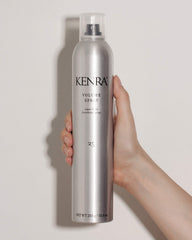 Kenra Volume Spray bottle close-up highlights flake-free, quick-drying performance.