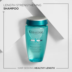 KÉRASTASE Bain Extentioniste bottle pour close-up emphasizing cleansing action