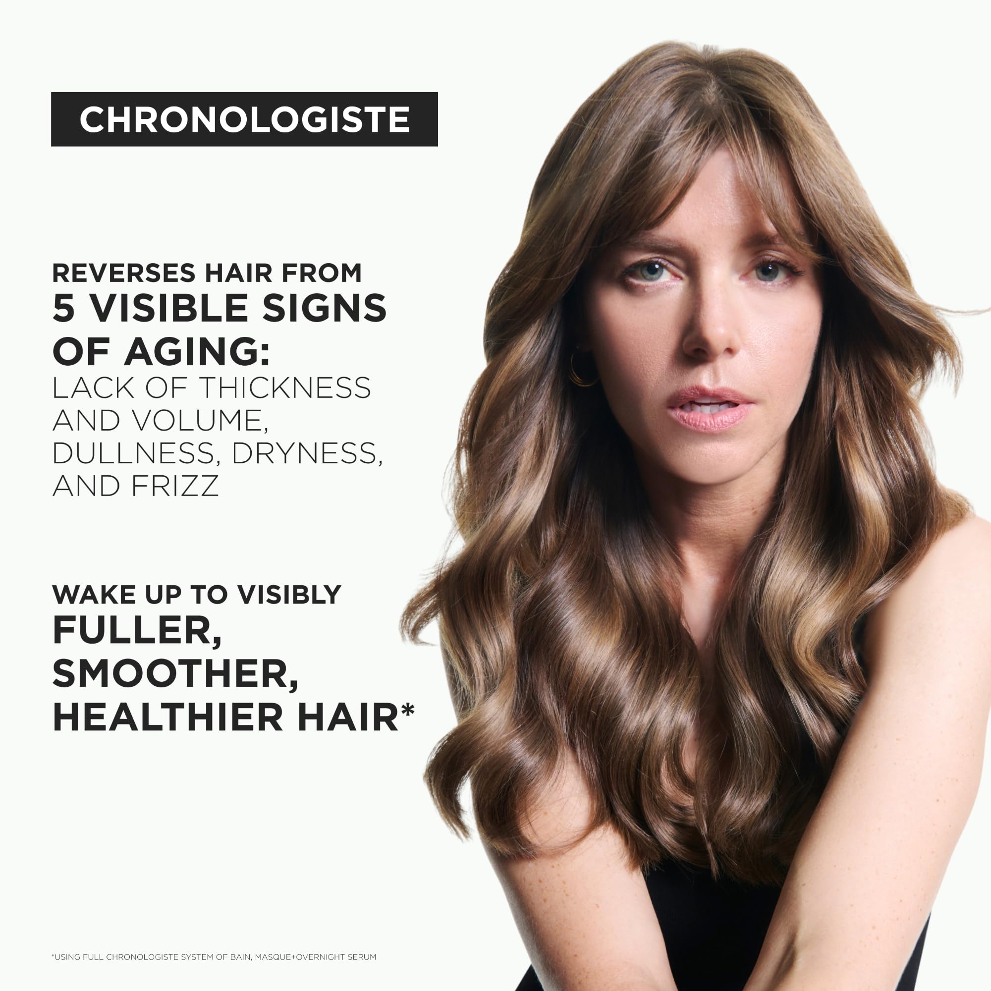 Vitamin E emblem beside Kerastase shampoo signaling hair protection.