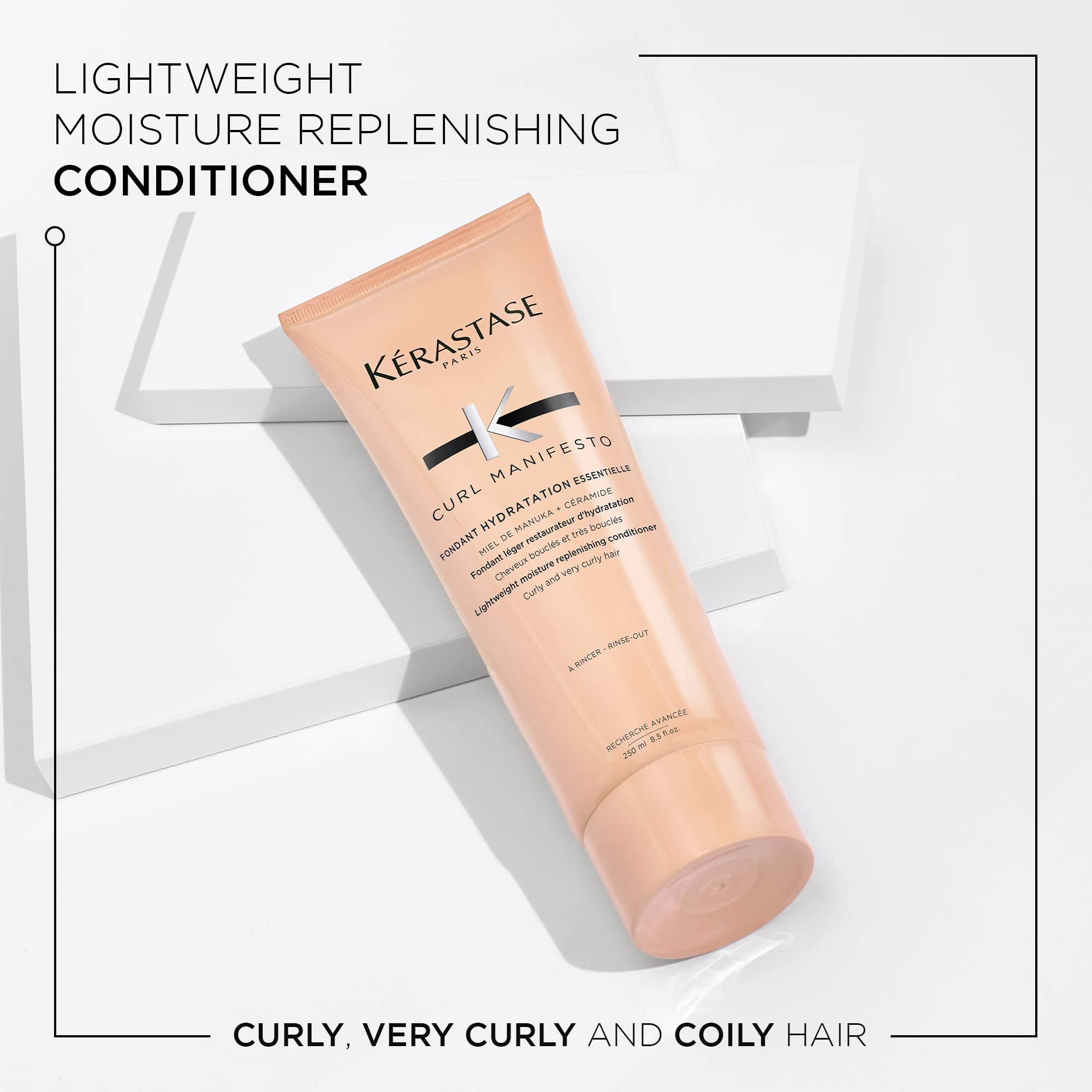KÉRASTASE Curl Manifesto Hydratation Essentielle bottle pour demonstrates detangling and smooth curls.