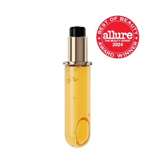 KÉRASTASE Elixir Ultime glass bottle shown with pump for easy, controlled application.