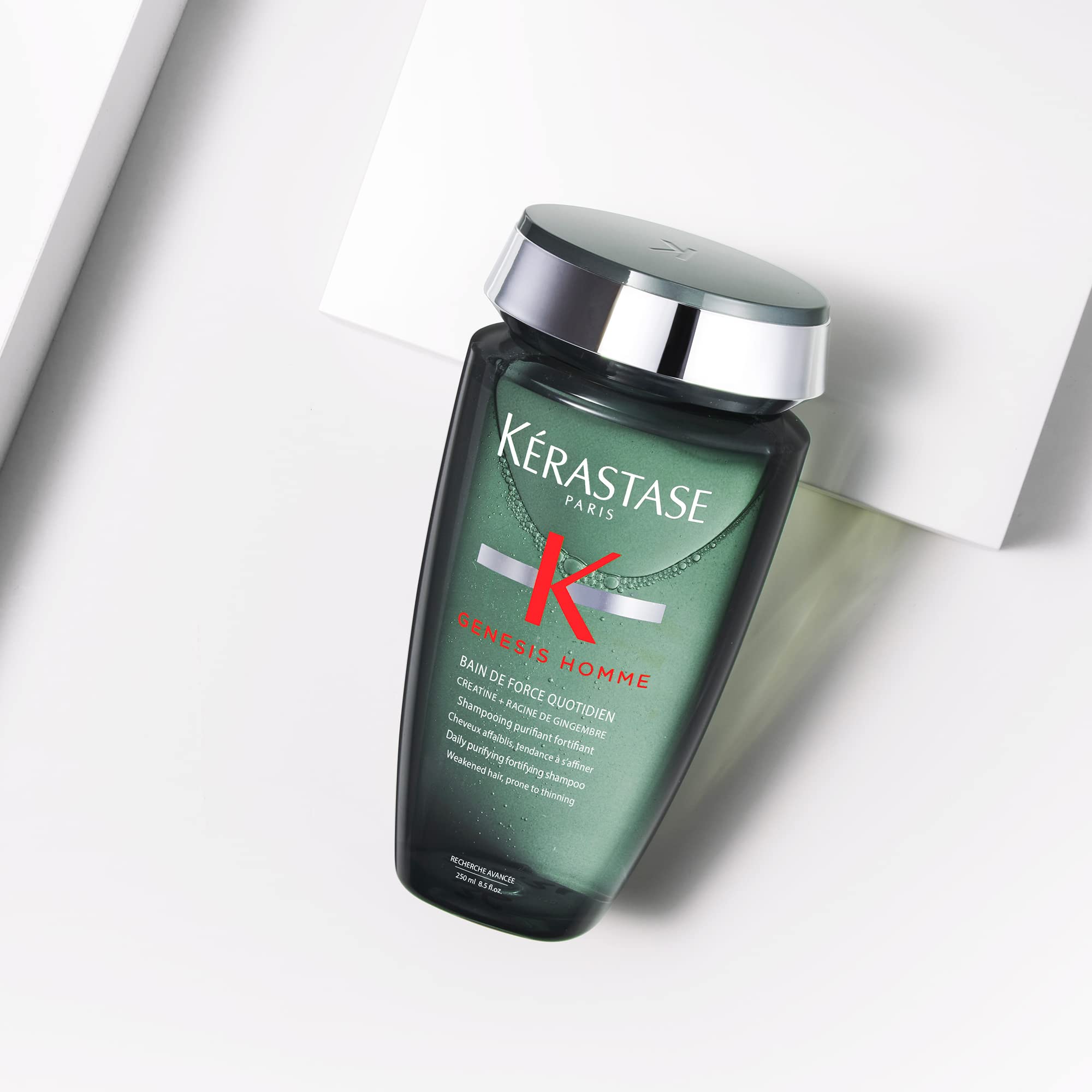 Kerastase Genesis Homme Bain De Force shampoo on a bathroom shelf