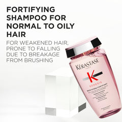 KÉRASTASE Genesis Hydra-Fortifiant shampoo bottle pour demonstrates easy, even application.