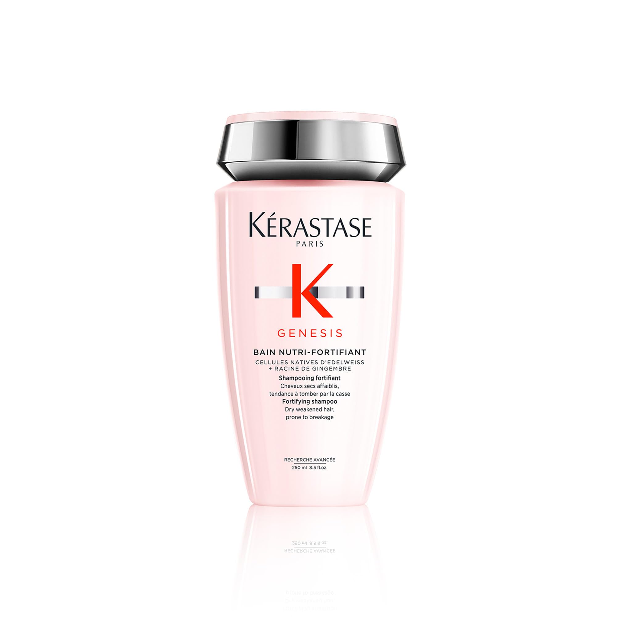 Kérastase Genesis Strengthening Shampoo bottle on counter supports scalp cleansing and hair fortification.