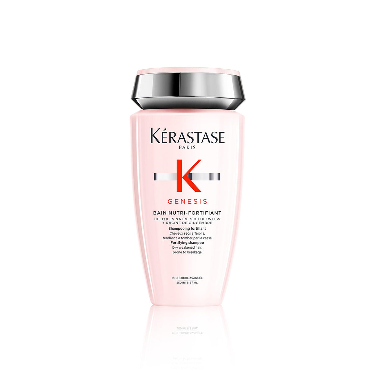 Kérastase Genesis Strengthening Shampoo bottle on counter supports scalp cleansing and hair fortification.