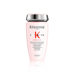 Kérastase Genesis Strengthening Shampoo bottle on counter supports scalp cleansing and hair fortification.