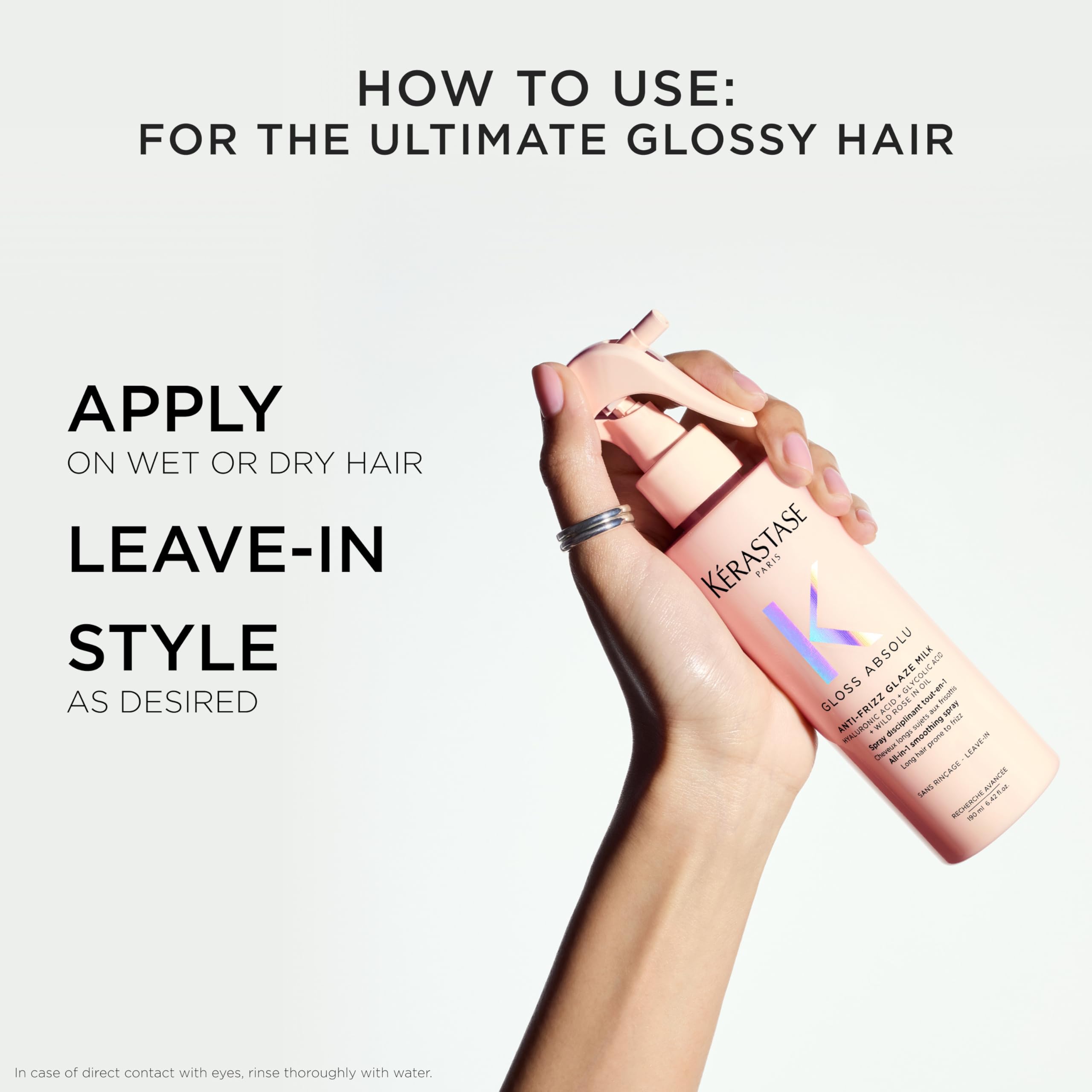 Model with sleek, shiny long hair after using Kerastase Glaze Milk.