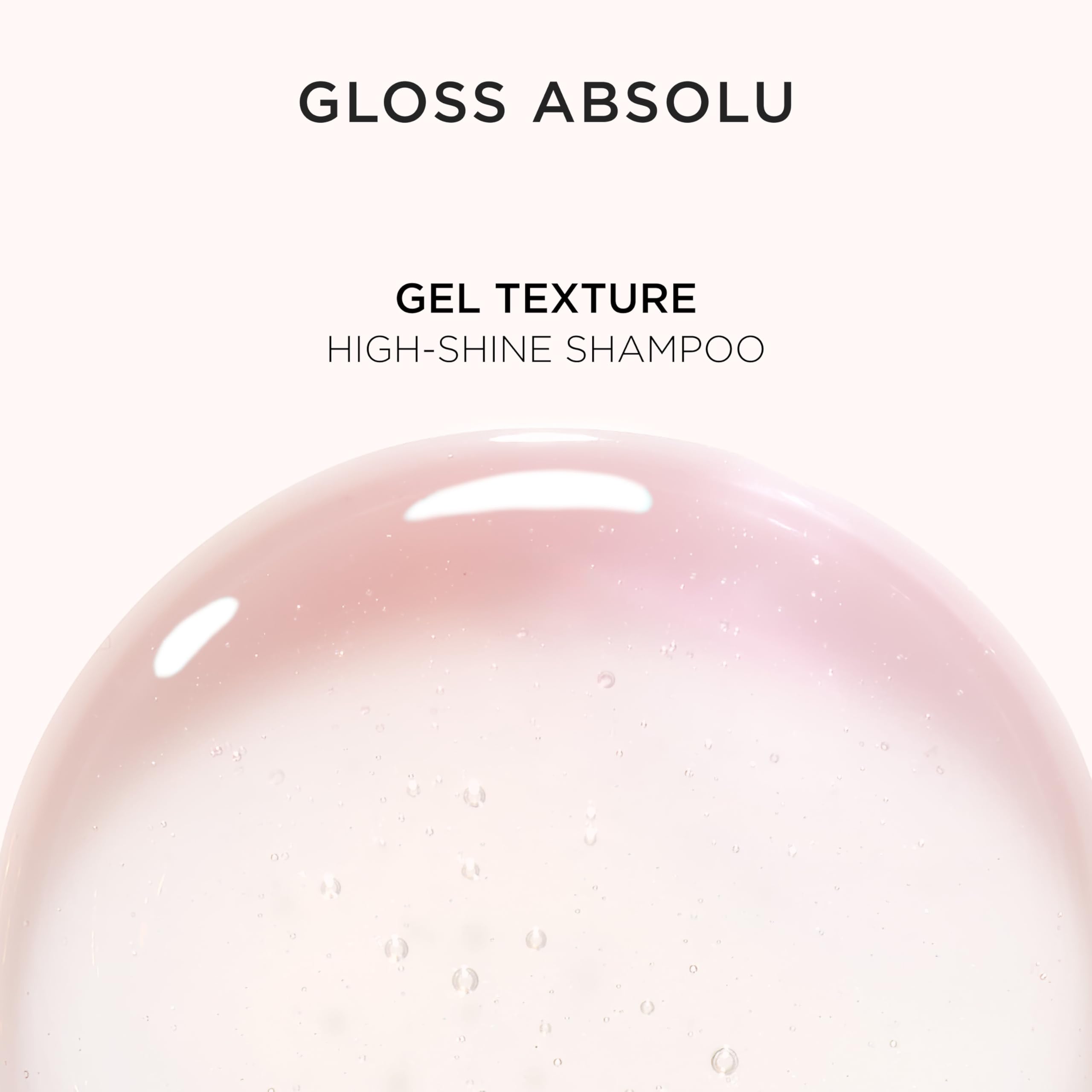 Kérastase Gloss Absolu bottle poured into hand in wash scene