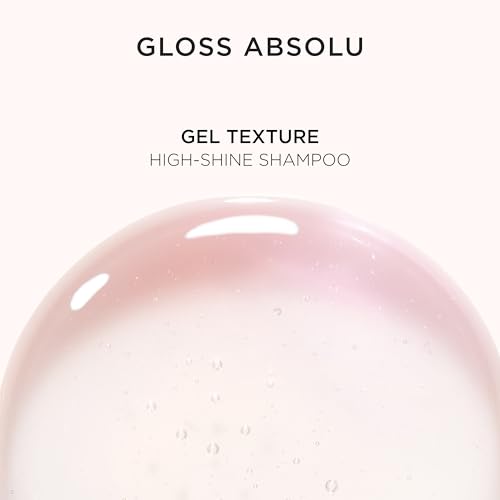 Kerastase Gloss Absolu display in a spa-like bathroom scene.