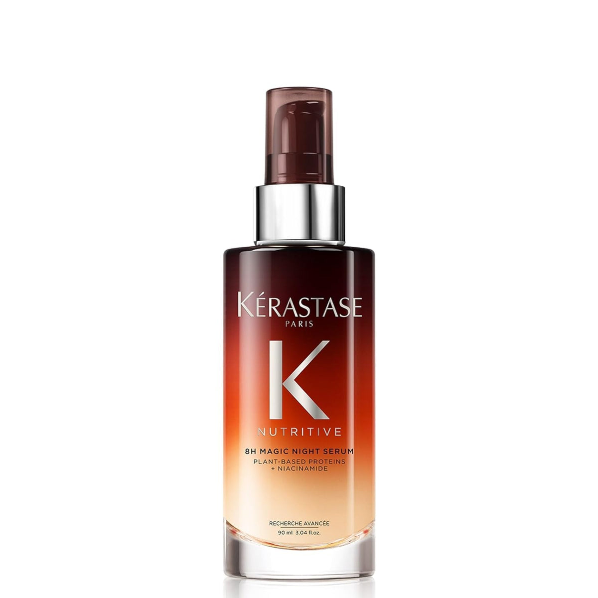 KÉRASTASE Nutritive 8H Night Serum bottle on a vanity for overnight care.