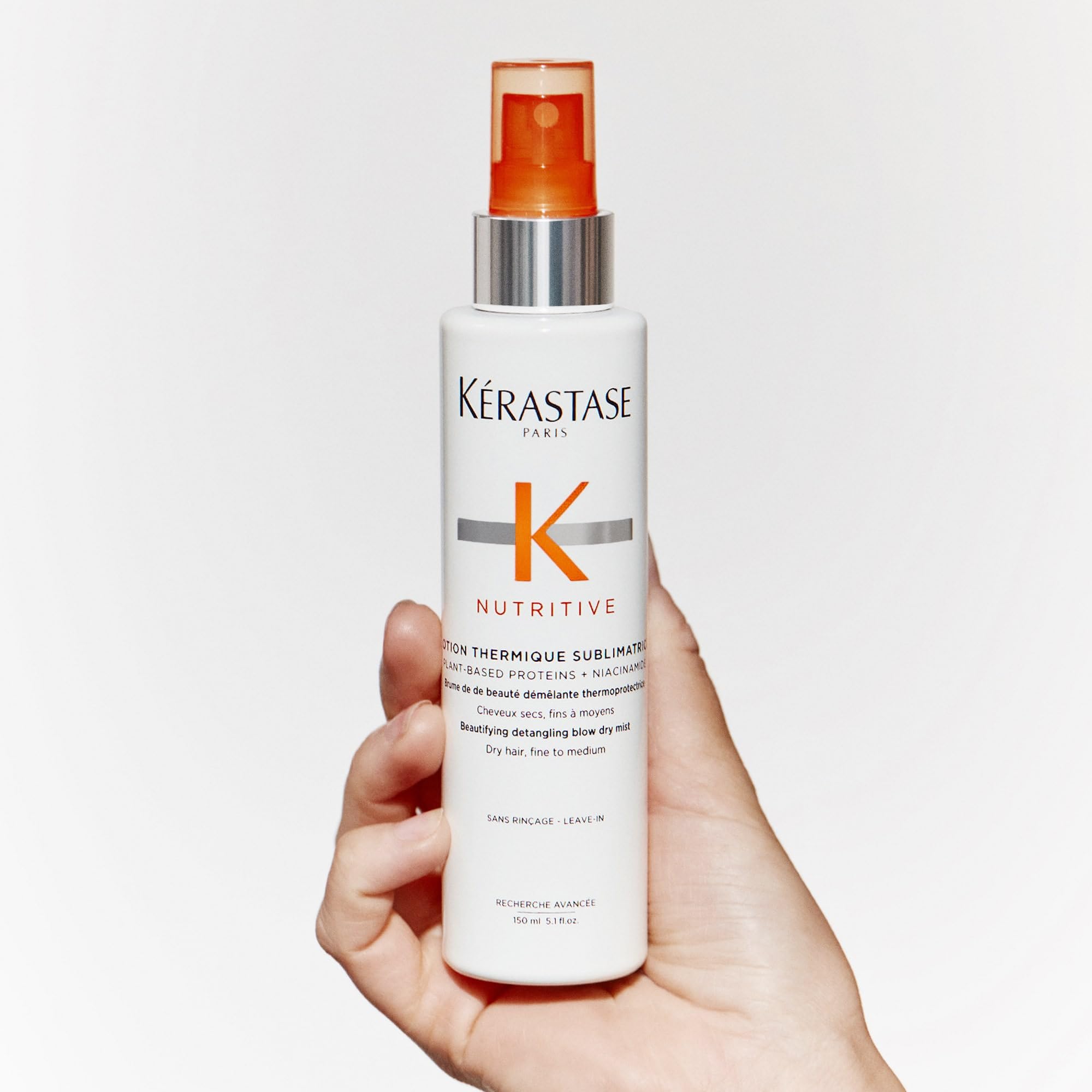 KÉRASTASE Nutritive spray during styling helps manage heat without weighing down.