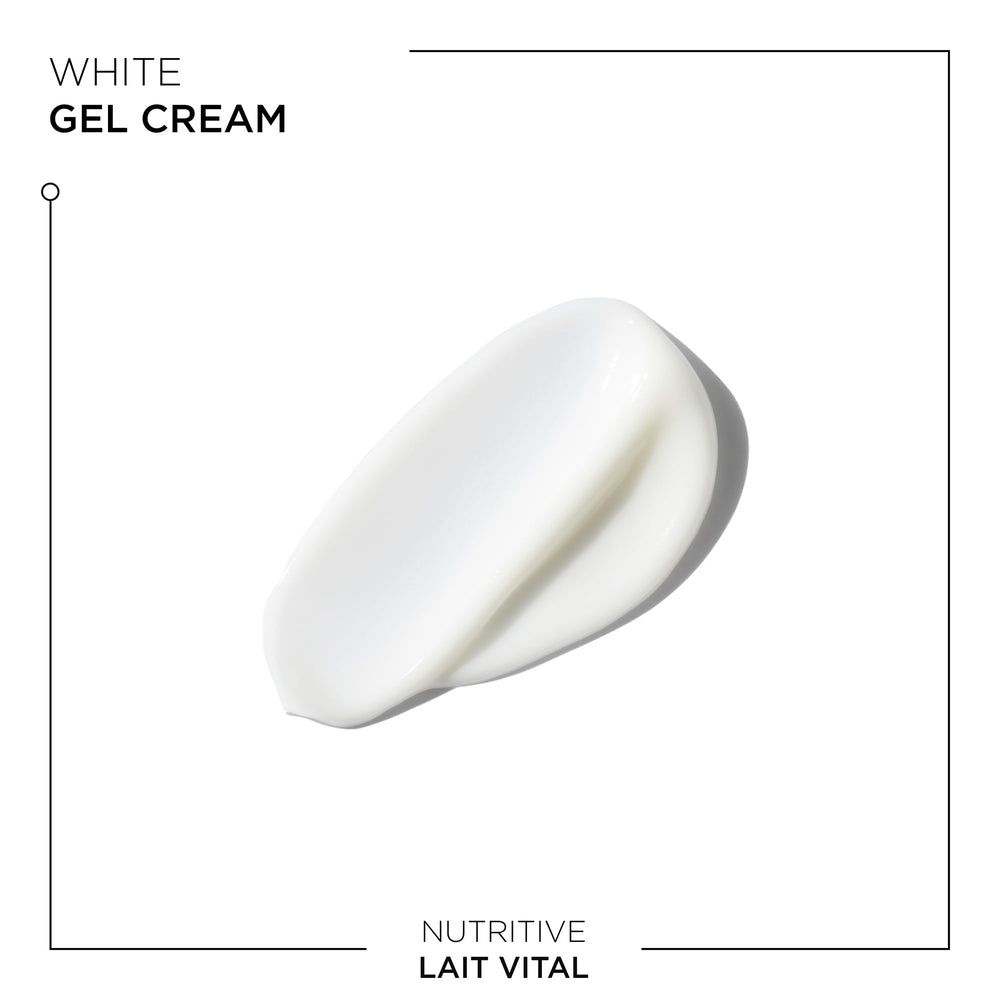 Travel-size tube sits beside skincare products for on-the-go routine.