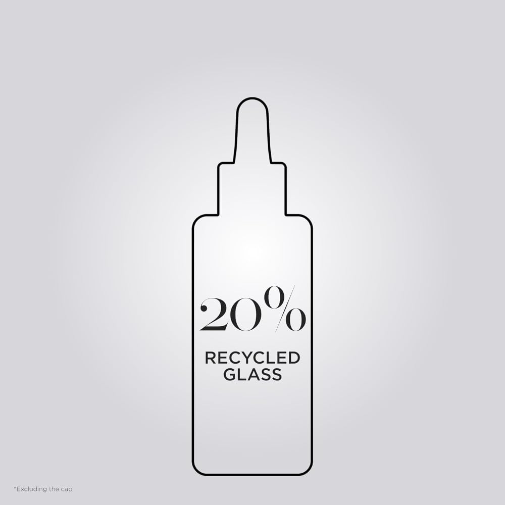 KÉRASTASE Première Repairing Gloss Oil dropper ready for precise use.