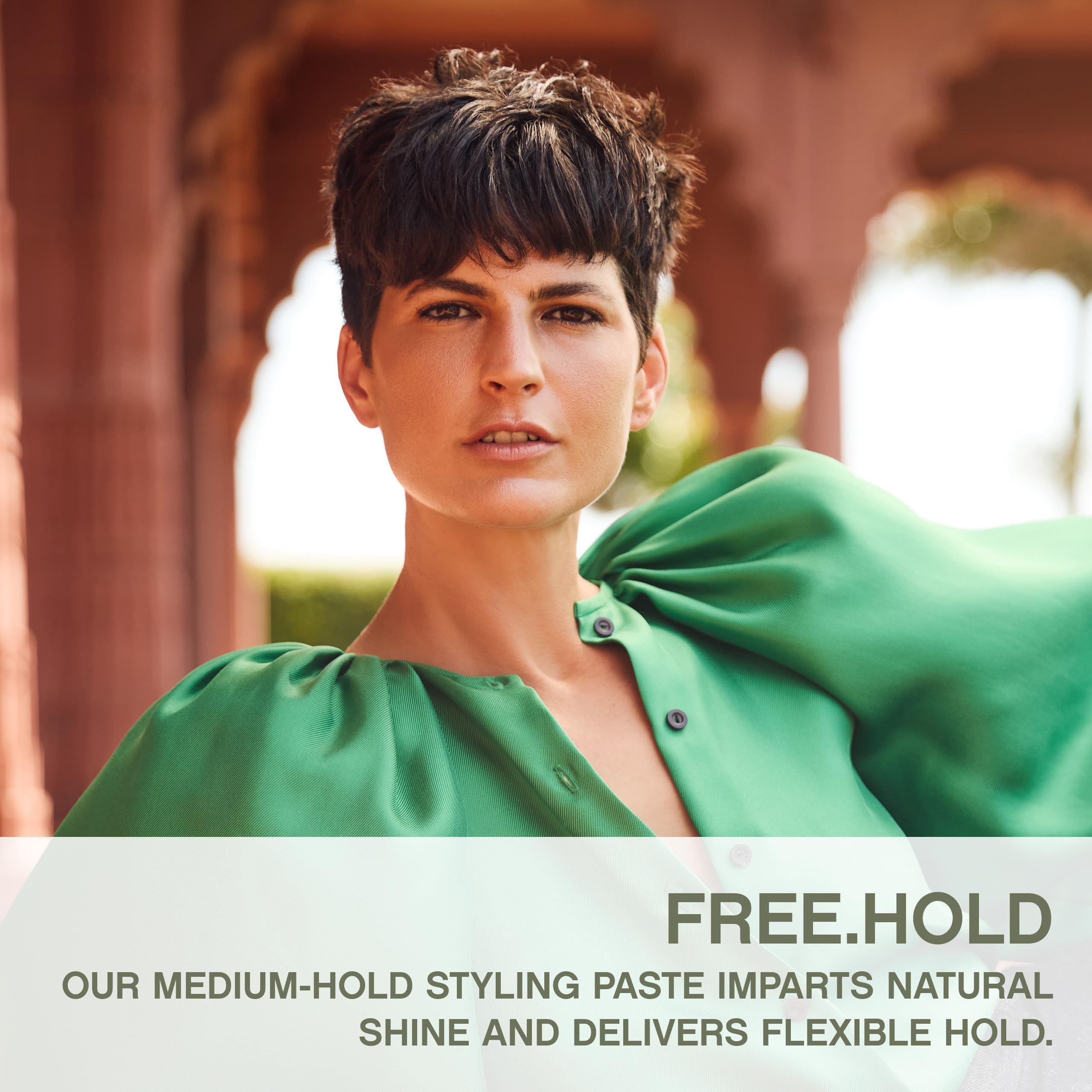 Hands applying KEVIN.MURPHY FREE.HOLD paste for natural-looking style