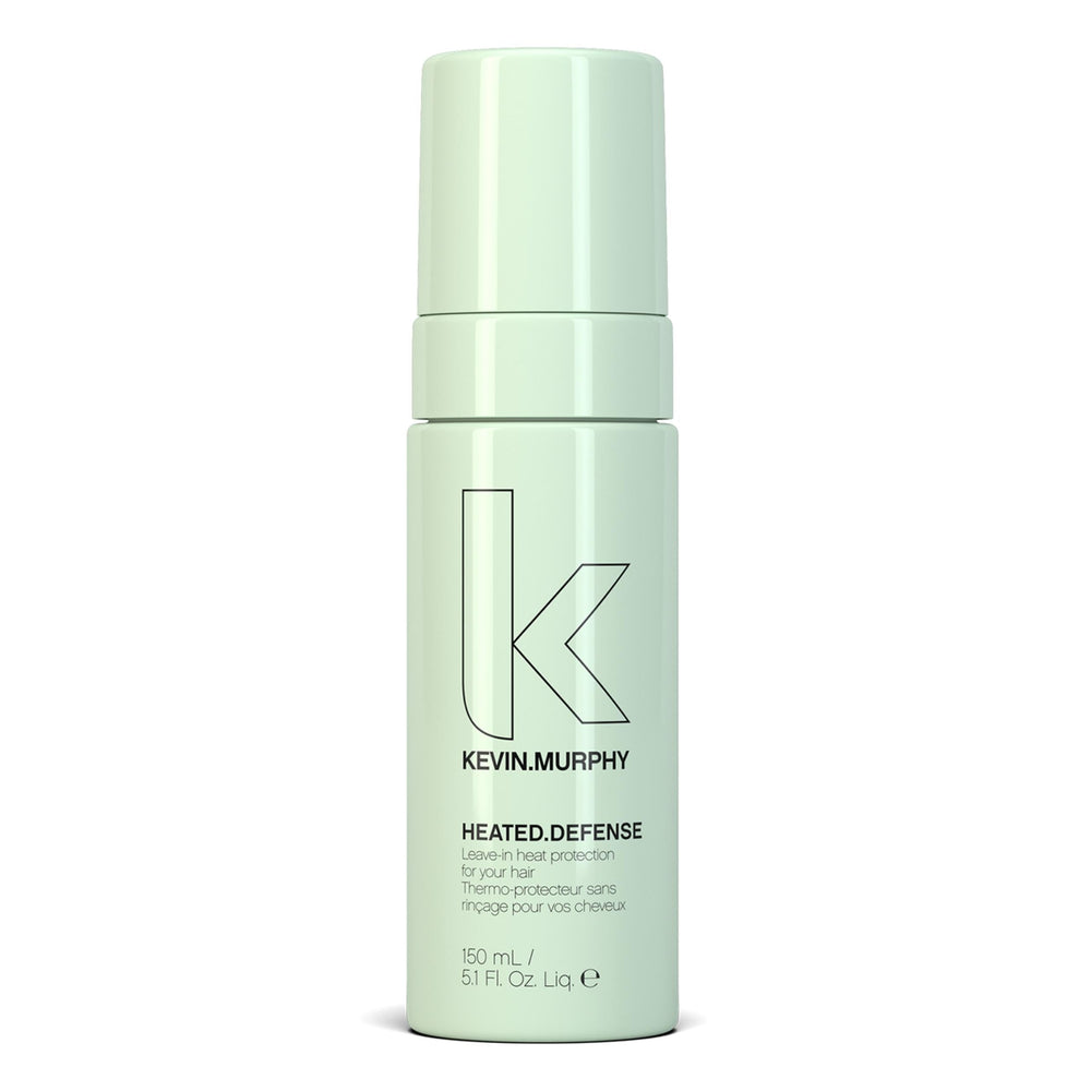KEVIN.MURPHY HEATED.DEFENSE bottle closeup showing heat protection for all hair types.