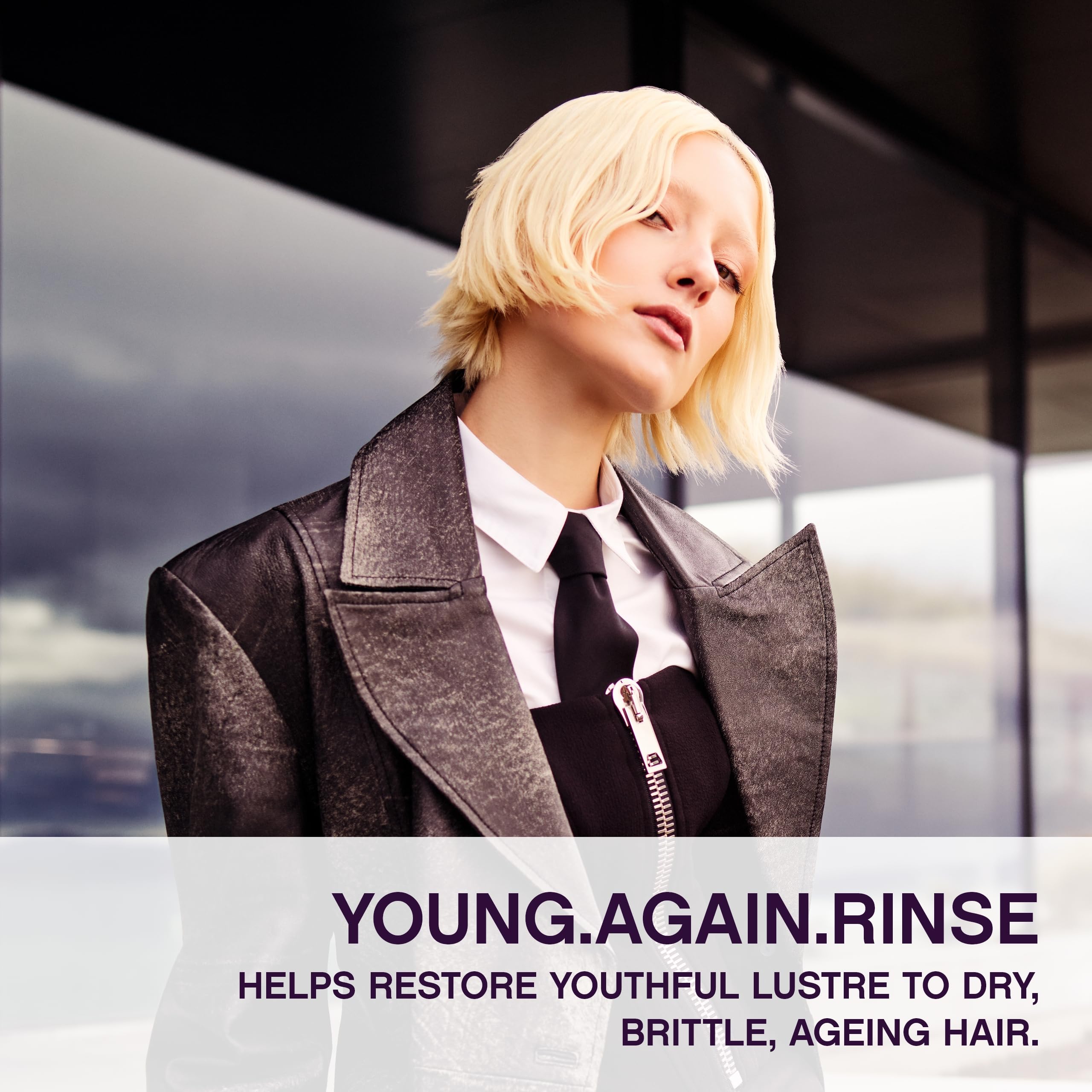 Applying KEVIN.MURPHY Young.Again.RINSE on hair to show creamy texture