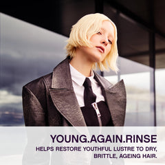 Applying KEVIN.MURPHY Young.Again.RINSE on hair to show creamy texture